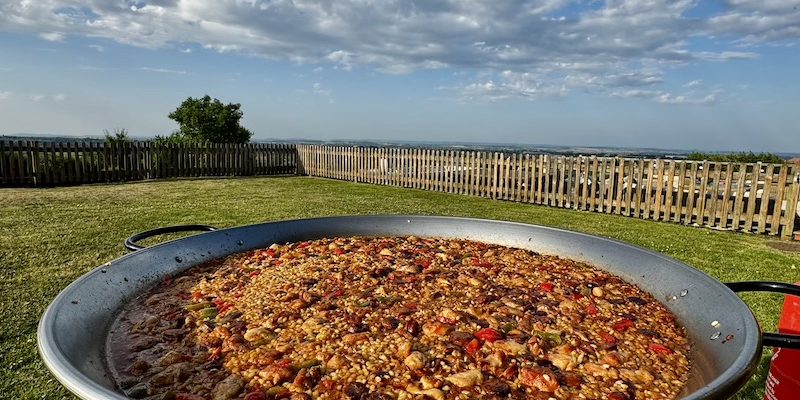 Bubbling paella pan at an outdoor hen do by Tapas Me The Plate